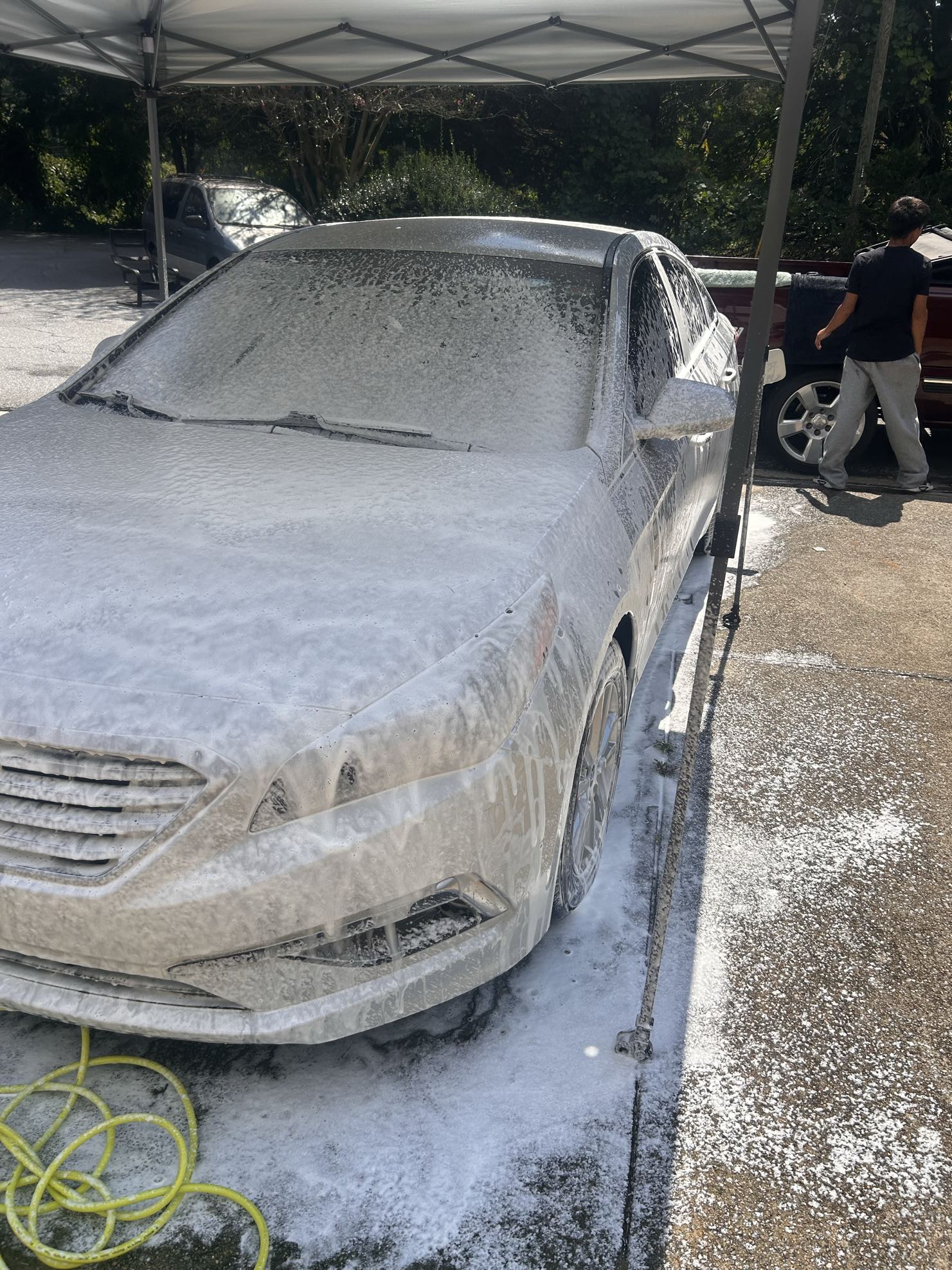 Sedan foam wash under tent